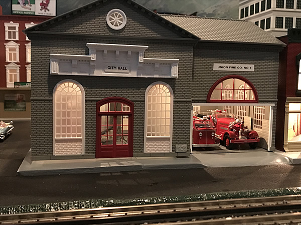 Layout photo of a model city hall and firehouse building